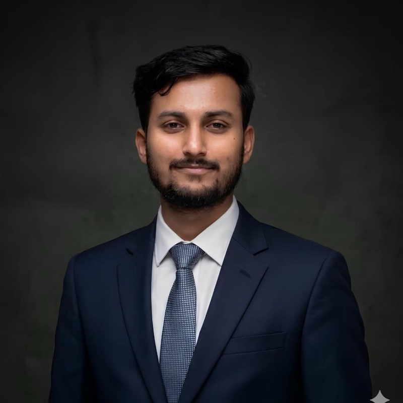 Portrait of Gazi Arman Islam, founder of Online Presence, in a navy suit